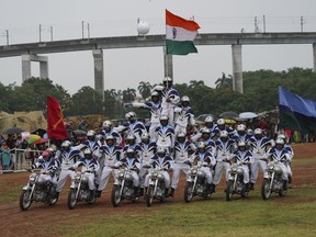Indian army soldiers display their skills on motorcycles on the eve of Independence Day in Hyderabad, India, Sunday, Aug. 14, 2022.