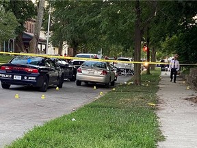 Evidence markers dot the scene, Wednesday, Aug. 10, 2022, on Richmond, Ind., where Richmond Police Department Officer Seara Burton was critically wounded and a man was injured in a shootout following a traffic stop.