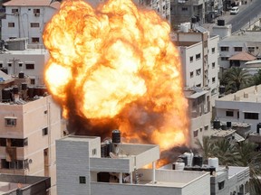 Flame and smoke rise during an Israeli air strike, amid Israel-Gaza fighting, in Gaza City Aug. 6.