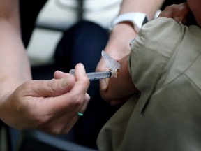 A registered nurse administers a vaccination to a young boy in Mount Vernon, Ohio on May 17, 2019. Some Ontario students are starting to receive suspension notices over out-of-date immunization records, but many health units are giving families more time to catch up. Students between the ages of four and 17 in the province are required to have certain vaccines to attend school but health units have said immunizations lagged during the pandemic. The Windsor-Essex County Health Unit says it has issued 7,858 suspension orders to students with incomplete immunization records, who now have until Sept. 12 to update them. Toronto Public Health, meanwhile, says it is behind on assessing immunization records due to the pandemic and is currently in the process of reviewing them while holding clinics to help students catch up.