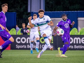 York United forward Osaze De Rosario, centre, is shown scoring against Pacific FC in a 4-2 loss in CPL soccer action in Toronto in this July 15, 2022 handout photo. York United forward Osaze De Rosario, son of former Canadian star Dwayne De Rosario, has been named the CPL's player of the week after a two-goal performance in a 4-2 win at HFX Wanderers FC on Monday. The 21-year-old now has eight goals this season to stand third in the league scoring race behind Pacific FC's Alejandro Diaz (13 goals) and Forge FC's Woobens Pacius (nine goals).
