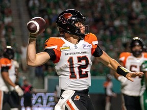 BC Lions quarterback Nathan Rourke (12) looks downfield before throwing against Saskatchewan Roughriders during the second quarter of CFL football action in Regina on August 19, 2022. B.C. Lions quarterback Nathan Rourke will undergo surgery for a sprain in his right foot, the CFL club announced Sunday.