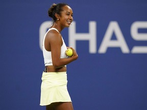 Leylah Fernandez, of Canada, smiles during a "The Tennis Plays for Peace" exhibition match to raise awareness and humanitarian aid for Ukraine Wednesday, August 24, 2022, in New York. Leylah Fernandez and Bianca Andreescu learned their first-round opponents at the 2022 U.S. Open Thursday as the Canadians look to make another deep run at the final tennis major of the season. Fernandez, the highest seeded Canadian woman at No. 14, opens against France's Oceane Dodin. Andreescu, who beat Williams in the 2019 final, opens against France's Harmony Tan.