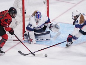 Team Canada forward Sarah Fillier (10) and Team United States forward Jesse Compher (18) battle for the puck in front of United States goalkeeper Alex Cavallini (33) during second period women's hockey gold medal game action at the 2022 Winter Olympics in Beijing on February 17, 2022. Canada's Marie-Philip Poulin and Sarah Fillier each scored four goals in a 14-1 win over Denmark in an international women's hockey exhibition game Saturday. The first meeting of the two countries in women's hockey since 1992 was a warmup for the world championship starting Thursday in Herning and Frederikshavn, Denmark. The Danes ranked 10th in the world are the host team for the first time. Canada, the reigning Olympic and world champions, is ranked No. 1.