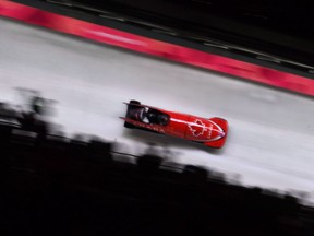Canadians race down the track during the men's two-man bobsled at the 2018 Winter Olympic Games in Pyeongchang, South Korea on February 18, 2018. More than 90 current and retired Canadian bobsled and skeleton athletes are renewing their call for action from federal Sport Minister Pascale St-Onge to help clean up what they say is a toxic climate in their national sport organization.