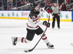 Canada's Connor Bedard (16) takes the shot against Latvia during second period IIHF World Junior Hockey Championship action in Edmonton on August 10, 2022.