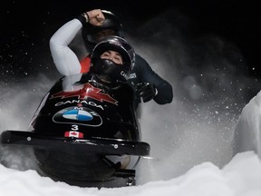 Canada's Chris Spring, front, of Calgary, Alta., and Neville Wright, of Edmonton, Alta., celebrate after crossing the finish line in their fourth run during the two-man bobsleigh event at the Bobsleigh World Championships in Whistler, B.C., on March 2, 2019. Chris Spring is a four-time Olympian who's competed for Canada in bobsled for close to a decade. But for the past four months, he's received no federal funding due to a dispute over his athlete's agreement. "There are some provisions in the athlete agreement that I don't agree with. And so I don't want to sign an agreement that I don't agree with just to get paid," Spring said.