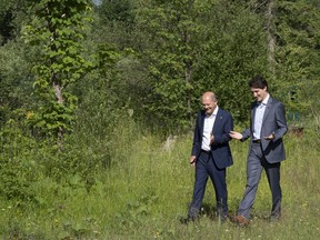 Prime Minister Justin Trudeau and Olaf Scholz, Chancellor of Germany take a stroll at the G7 Summit in Schloss Elmau on June 27, 2022. Prime Minister Justin Trudeau and German Chancellor Olaf Scholz plan to attend a networking luncheon in Montreal today with German and Canadian business representatives. Trudeau's office says the leaders hope to encourage investment and partnership opportunities, including in the critical minerals and automotive sectors. The leaders then plan to tour a national artificial intelligence institute funded by the federal government.
