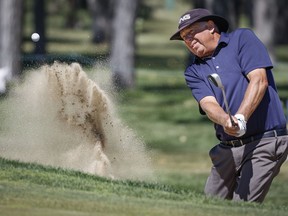 Kirk Triplett, of the United States, hits from a sand trap during the PGA Tour Champions Shaw Charity Classic golf event in Calgary, Alta., Saturday, Aug. 6, 2022.THE CANADIAN PRESS/Jeff McIntosh