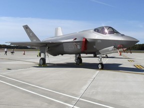 FILE - An F-35 fighter jet arrives at the Vermont Air National Guard base in South Burlington, Vt, Sept. 19, 2019. Switzerland's defense department says any delay to a planned multibillion-dollar acquisition of U.S.-made F-35 fighter jets would have "grave consequences" for Swiss security. On Tuesday, Aug. 23, 2022 the Swiss government announced that campaigners had cleared the bar of more than 100,000 signatures of a petition by citizens calling for a referendum on the planned purchase of 36 of the Lockheed Martin-built jets.