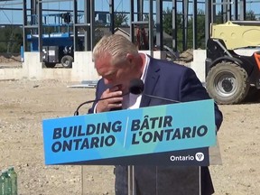 Ontario Premier Doug Ford reacts after a bee flew into his mouth during a press conference in Dundalk, Ont., on Friday, August 12, 2022, in this image taken from video.