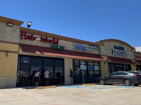 FILE - This photo shows the exterior of Hair World Salon in Dallas, on May 12, 2022. A man accused of shooting three Asian American women at the hair salon was indicted Tuesday, Aug. 9, on multiple counts, including committing a hate crime.