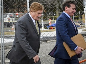 FILE - Robert Fehring, left, arrives at federal court with his attorney in Central Islip, NY, Wednesday, Feb. 23, 2022. Fehring has been sentenced to 30 months in prison for mailing dozens of violent threats to LGBTQ affiliated individuals, groups and businesses over several years, Wednesday, Aug. 3, 2022.