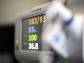 FILE - In this Aug. 8, 2020, photo a patient's vital signs are displayed on a monitor at a hospital in Portland, Ore. At its current pace, Medicare's Hospital Insurance trust fund will run out of money in 2028, according to the latest Medicare trustees report. That's a two-year extension on the previous estimate.