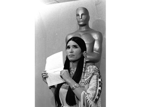 FILE - Sacheen Littlefeather appears at the Academy Awards ceremony to announce that Marlon Brando was declining his Oscar as best actor for his role in "The Godfather," on March 27, 1973. The move was meant to protest Hollywood's treatment of American Indians. Nearly 50 years later, the Academy of Motion Pictures Arts and Sciences has apologized to Littlefeather for the abuse she endured. The Academy Museum of Motion Pictures on Monday said that it will host Littlefeather, now 75, for an evening of "conversation, healing and celebration" on Sept. 17. (AP Photo, File)