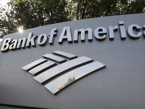 FILE - A Bank of America logo is displayed at a branch office in Palo Alto, Calif., Monday, Sept. 12, 2011. Bank of America says, Wednesday, Aug. 17, 2022, the revenue it gets from overdrafts has dropped 90% from a year ago, after the bank reduced overdraft fees to $10 from $35 and eliminated fees for bounced checks.