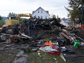 A house that was destroyed by a fatal fire is viewed in Nescopeck, Pa., Friday, Aug. 5, 2022. Multiple people are feared dead after the fire early Friday in northeastern Pennsylvania, according to a volunteer firefighter who responded and said the victims were his relatives. A criminal investigation is underway, police said.