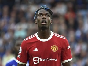 FILE - Manchester United's Paul Pogba looks up during the English Premier League soccer match between Leicester City and Manchester United at King Power stadium in Leicester, England, Saturday, Oct. 16, 2021. French prosecutors are investigating allegations that World Cup winner Paul Pogba was targeted by extortion attempts by his brother and childhood friends. The Paris prosecutor's office said Monday Aug. 29, 2022 it opened an investigation earlier this month into attempted organized extortion, which is being handled by anti-corruption police.