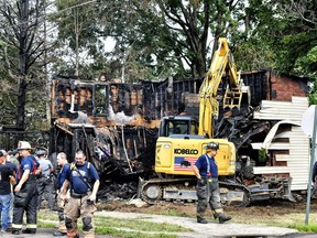 Crews work to demolish a house that was destroyed by a fatal fire on the 700 block of 1st St. in Nescopeck, Pa., Friday, Aug. 5, 2022. Multiple people are feared dead after a house fire early Friday in northeastern Pennsylvania, according to a volunteer firefighter who responded and said the victims were his relatives. A criminal investigation is underway, police said.
