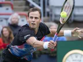 Canada's Vasek Pospisil returns to Tommy Paul of the United States during first round action at the National Bank Open tennis tournament Aug. 9, 2022 in Montreal. Pospisil made it through the first round of qualifying at the U.S. Open with a 7-6 (2), 6-4 win over Sumit Nagal on Wednesday.