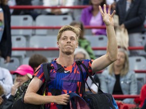 Canada's Denis Shapovalov walks off the court after losing to Alex de Minaur of Australia during first round of play at the National Bank Open tennis tournament Tuesday August 9, 2022 in Montreal.
