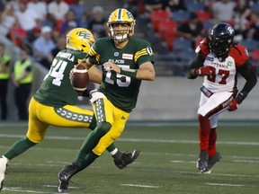 Edmonton Elks quarterback Taylor Cornelius (15) runs with the ball during first half CFL action against the Ottawa Redblacks in Ottawa on Friday, August 19, 2022.