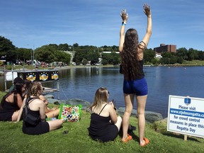 History will be made today at a 204-year-old rowing race in St. John's as four women's teams tackle a course that has historically been reserved for men. A female rowing team watches a race during the Royal St. John's Regatta at Quidi Vidi Lake in St. John's N.L., on Thursday, August 5, 2021.