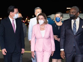 This handout picture taken and released by Taiwans Ministry of Foreign Affairs (MOFA) on August 2, 2022 shows Speaker of the U.S. House of Representatives Nancy Pelosi being welcomed upon her arrival at Sungshan Airport in Taipei.