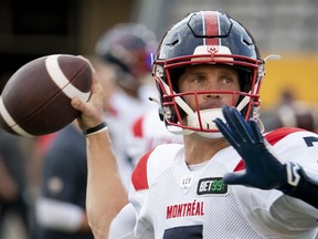 Montreal Alouettes quarterback Trevor Harris (7) throws during warm up prior to CFL football game action against the Hamilton Tiger-Cats in Hamilton, Ont. on Thursday, July 28, 2022. It's now up to Harris and the Alouettes to try and accomplish something no other CFL team has so far this season -- beat Winnipeg.THE CANADIAN PRESS/Peter Power