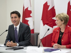 Prime Minister Justin Trudeau, along with Karen Redman, Chair, Region of Waterloo, participates in a housing round table at the Country Hills Library in Kitchener, Ont. on Tuesday, Aug. 30, 2022.