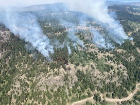 Smoke from fires along Sheep Creek is shown in an Aug.7, 2022 handout photo from the BC Wildfire Service. The BC Wildfire Service says the the wildfire covers 68 square kilometres southwest of Penticton, with most of the recent growth due to planned ignitions needed to create the control lines.THE CANADIAN PRESS/HO-BC Wildfire Service **MANDATORY CREDIT**