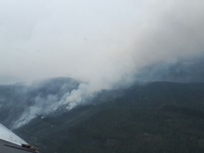 In this handout image a wildfire is seen burning approximately 19 kilometres southeast of Wrigley, N.W.T., on Aug. 20, 2022. The 2022 wildfire season in the Northwest Territories is shaping up to be one of the most severe in the past five years.