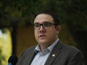 Jason Nixon is seen during a news conference, in Calgary, Tuesday, Sept. 15, 2020. Alberta's finance minister says the government is going to use this year's projected windfall budget surplus to pay down debt and put some cash in the piggy bank.THE CANADIAN PRESS/Todd Korol