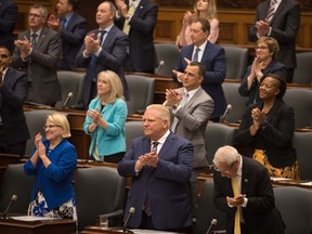 Doug Ford claps during Ted Arnott's acceptance speech for his re-election to the position of Speaker of the Ontario Legislative Assembly at Queen's Park, in Toronto on Monday, August 8, 2022. The Ontario premier is set to present a vision today for what he hopes to accomplish with a new term of government, as well as reintroduce this year's budget.THE CANADIAN PRESS/Tijana Martin