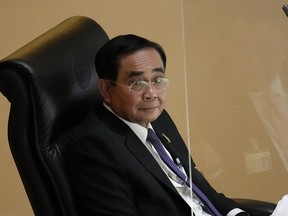 FILE - Thailand Prime Minister Prayuth Chan-ocha attends a no-confidence debate at the Parliament in Bangkok, Thailand, on July 19, 2022. Constitutional Court said Prayuth must suspend duties while it decides if he overstayed legal term limit on Aug. 24, 2022.