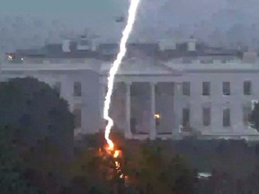 A lightning strike hits a tree in Lafayette Park across from the White House, killing three people and injuring one person below, during an Aug. 4 evening thunderstom.