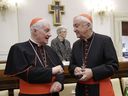 Cardinal Marc Ouellet, left, talks with Cardinal Vincent Nichols, before the start of an event at the Vatican on October 12, 2019. Quebec Cardinal Marc Ouellet has been accused of sexual assault in a class-action lawsuit against the Catholic Church in Quebec.