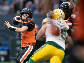 B.C. Lions quarterback Nathan Rourke passes during the first half of CFL football game against the Edmonton Elks in Vancouver, on Saturday, August 6, 2022.
