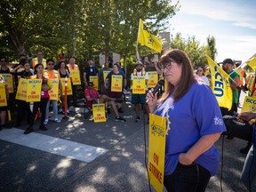BC General Employees' Union president Stephanie Smith addresses employees on the picket line outside a B.C. Liquor Distribution Branch facility, in Delta, B.C., on Monday, Aug. 15, 2022. B.C.'s largest public-sector union says it has accepted the government's invitation to resume talks following limited job action that began over a week ago.THE CANADIAN PRESS/Darryl Dyck