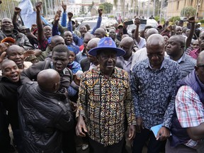 Kenyan presidential candidate Raila Odinga, center, arrives prior to delivering an address to the nation at his campaign headquarters in downtown Nairobi, Kenya, Tuesday, Aug. 16, 2022. Kenya is calm a day after Deputy President William Ruto was declared the winner of the narrow presidential election over longtime opposition figure Raila Odinga.