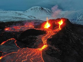 Lava flows from an eruption of a volcano on the Reykjanes Peninsula in Iceland on March 28, 2021. On Wednedsay, August 3, 2022, the Icelandic Meteorological Office said an eruption had started near Fagradalsfjall.