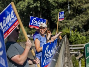 Republican Rep. Jaime Herrera Beutler does some last minute campaigning over Interstate 5 with supporters in Vancouver, Wash. Tuesday, Aug. 2, 2022.