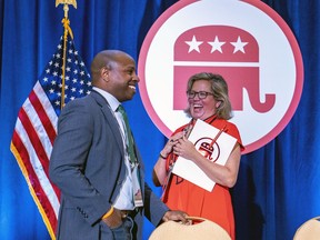 Milwaukee Mayor Cavalier Johnson, left, speaks with Cam Henderson, right, from the Republican National Committee, at the JW Marriott in Chicago ahead of Milwaukee's expected selection to host the 2024 Republican National Convention, Friday, Aug. 5, 2022.