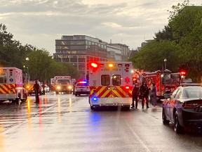 In this photo provided by @dcfireems, emergency medical crews are staged on Pennsylvania Avenue between the White House and Lafayette Park, Thursday evening, Aug. 4, 2022 in Washington. Two people who were critically injured in a lightning strike in Lafayette Park outside the White House have died, police said Friday. Two others remained hospitalized with life-threatening injuries. (@dcfireems via AP)