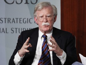 FILE - Former National security adviser John Bolton gestures while speaking at the Center for Strategic and International Studies (CSIS) in Washington, Sept. 30, 2019. An Iranian operative is charged in plot to murder Bolton, a Trump administration national security adviser.