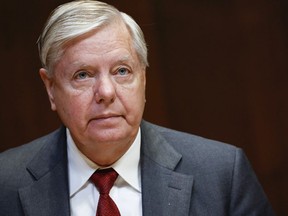 FILE - Sen. Lindsey Graham, R-S.C., listens during a hearing on the fiscal year 2023 budget for the FBI in Washington, on May 25, 2022. Attorneys for Graham said in a court filing on July 13, he wasn't trying to interfere in Georgia's 2020 election when he called state officials to ask them to reexamine certain absentee ballots after President Donald Trump's narrow loss to Democrat Joe Biden.