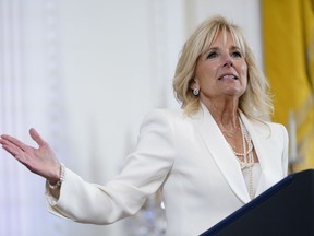 FILE - First lady Jill Biden speaks at an event in the East Room of the White House, June 15, 2022, in Washington. White House says the first lady has tested negative for COVID-19 and will return to the Washington, area on Tuesday, Aug. 30.