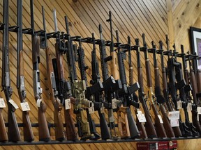 Various guns are displayed at a store on July 18, 2022, in Auburn, Maine. Most U.S. adults think gun violence is increasing nationwide and want to see gun laws made stricter. That's according to a new poll that finds broad public support for a variety of gun restrictions. The poll comes from the University of Chicago Harris School of Public Policy and The Associated Press-NORC Center for Public Affairs Research.