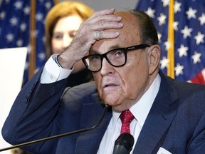 FILE - Former New York Mayor Rudy Giuliani, who was a lawyer for former President Donald Trump, speaks during a news conference at the Republican National Committee headquarters in Washington, on Nov. 19, 2020. Giuliani is scheduled to appear in an Atlanta courthouse on Aug. 17, 2022, to testify before a special grand jury in an investigation into possible illegal attempts to influence the 2020 election in Georgia.