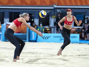 Sarah Pavan, left, and Melissa Humana-Paredes of Canada return a shot in womens beach volleyball competition against Australia at the Commonwealth Games in Birmingham, England on Sunday, Aug. 7, 2022.&ampnbsp;Canada's world beach volleyball champions Pavan and Humana-Paredes are ending their partnership.&ampnbsp;CANADIAN PRESS/Andrew Vaughan